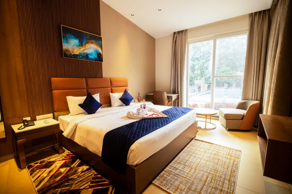 Customized bedroom interior design with wardrobe, wooden flooring, and ambient lighting in Vellore.