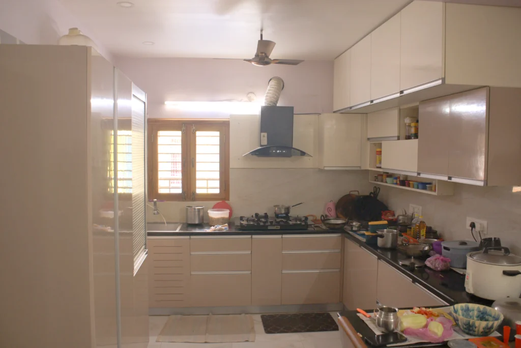 Modern modular kitchen with soft-close cabinets, quartz countertop, and customized storage solutions in vellore.